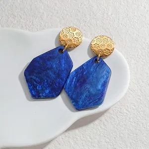 Unique irregular blue acrylic drop earrings with gold embossed floral metal stud