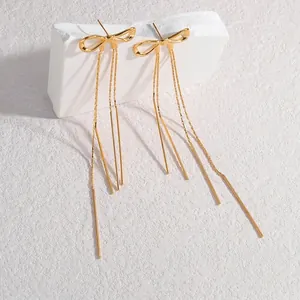 Elegant gold bow long tassel earrings with shimmering metal fringe dangles for women