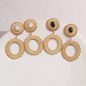 Boucles d'oreilles pendantes ovales dorées avec motifs de texture solaire vintage chic