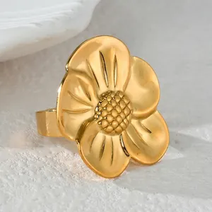 Minimalist gold irregular flower open ring with detailed textured stamen in stainless steel