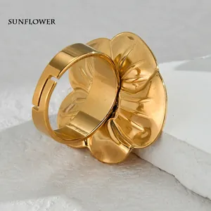 Irregular golden flower titanium steel ring with adjustable band and polished finish
