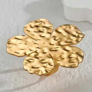 Elegant gold five-petal flower ring with hammered texture and minimalist open design