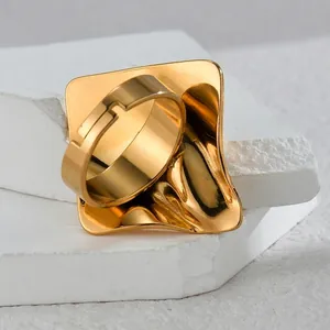 Irregular geometric gold ring with liquid metal texture and wavy square surface