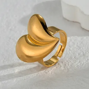 Unique irregular heart-shaped open ring in gold stainless steel on stone