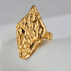 Exaggerated geometric wrinkled ring in 18K gold plated stainless steel with lava texture
