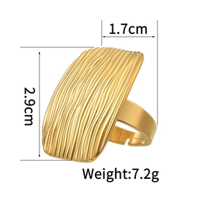 Detail showing the 1.7cm x 2.9cm gold rectangle ring with vertical brushed texture