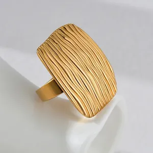 Retro irregular titanium steel gold ring with grooved vertical stripes and wide polished band