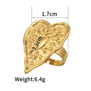 Detailed view of large hammered gold heart ring with size markings 1.7cm and 3.1cm