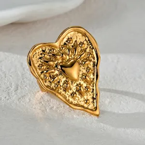 French vintage style heart ring with hammered gold texture and chunky relief design