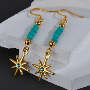 Boucles d'oreilles bohèmes en étoile dorée avec perles turquoise et pendentifs