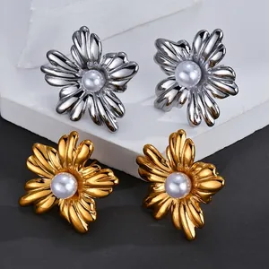 Elegant floral stud earrings with pearls in gold and silver finish on white background