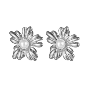 Detail view of silver floral stud earrings with pearl center and textured petals