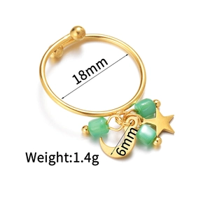 Macro detail of star and moon tassel ring with green beads showing size specifications