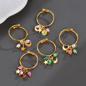 Five-piece gold stainless steel ring set with colorful beads and celestial star moon charms