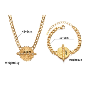 Detailed view of gold stainless steel necklace and bracelet set with size measurements