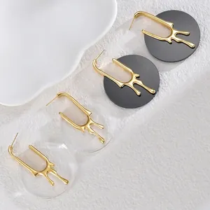 Boucles d'oreilles géométriques style lave liquide avec finition dorée et acrylique