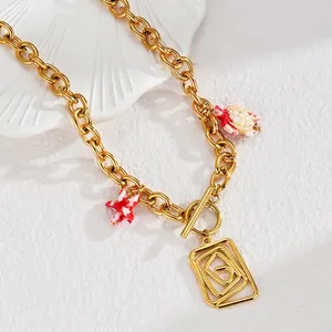 Collier vintage doré avec fermoir OT, pendentifs tortue de tortue, étoile de mer et breloque