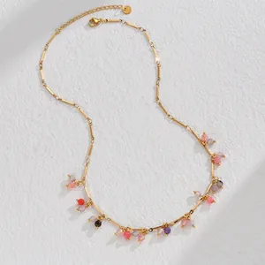Close-up of bohemian colorful beaded tassels on a gold-plated stainless steel necklace