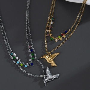 Double-layer minimalist bird necklace with colorful beads and star charms in polished finish