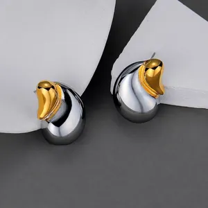 Elegant two-tone gold and silver water drop earrings with a modern polished finish