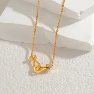 Minimalist interlocking double ring necklace in gold finish on white stone surface