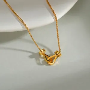 Minimalist double horseshoe interlocking gold necklace with geometric box chain links