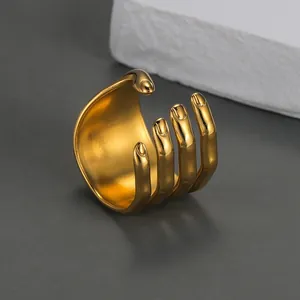 Macro shot of 18k gold plated stainless steel palm hand shaped open ring detail