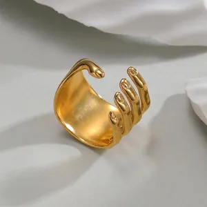 Creative hand hug open ring in 18k gold matte titanium steel for a unique fashion look