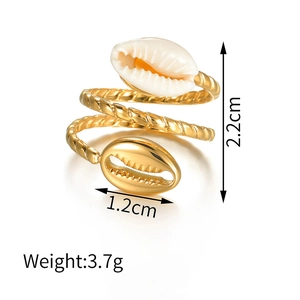 Detailed view showing shell ring dimensions and twisted gold multi-layer wrap design