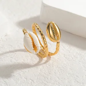 Multi-layer gold shell wrap ring with sea-inspired spiral texture and dual shell details