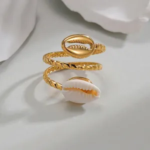 Golden multi-layer shell open ring with twisted rope texture and marine design