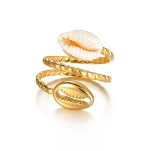 Golden spiral shell ring with twisted rope texture and natural cowrie shell detail