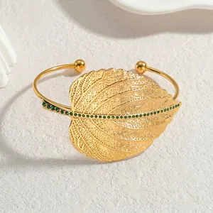 French vintage style open leaf bangle in gold finish with green emerald zircon accents