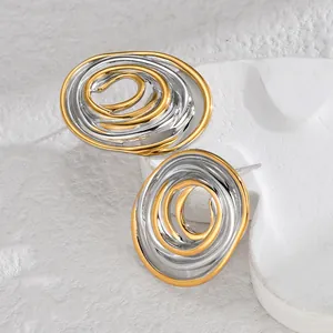 Minimalist irregular geometric oval stud earrings in mixed gold and silver polished finish