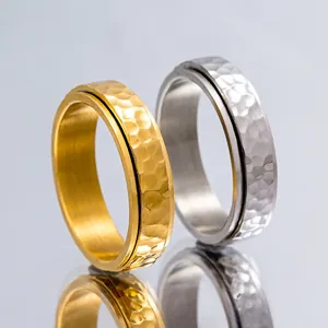 Bague rotative irrégulière minimaliste en finitions or et argent pour soulager le stress