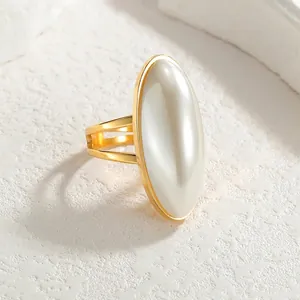 Elegant gold oval pearl ring for women featuring a minimalist adjustable stainless steel band