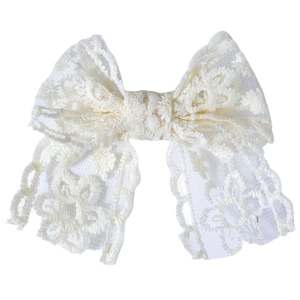 Bandeau à nœud en dentelle crème pour bébés avec motifs floraux ajourés élégants