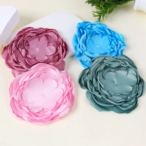 Detailed view of handmade 9-layer matte fabric flowers in various elegant colors