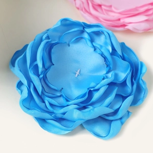 Close-up of a 10cm blue 9-layer handmade satin flower showing petals and texture