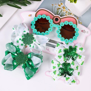 Set San Patrizio con occhiali a trifoglio e fiocchi verdi per capelli per bambini