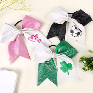 Close-up of sequin bows with hearts, soccer balls, and clovers for girls' hair