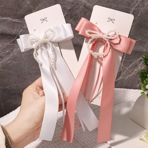 Elegante französische Satinschleifen-Haarspangen mit langen Quasten und Perlen in Weiß und Rosa