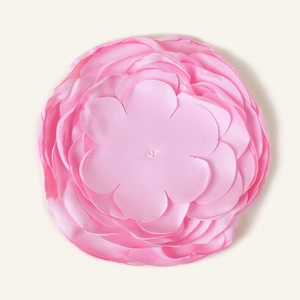 Detail of a 10cm pink multilayer silk satin flower for DIY hair and garment accessories