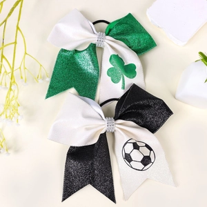 Glittering cheer bows with shamrock and soccer patterns featuring rhinestone centers