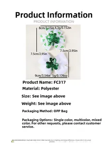 Detail of St. Patrick's Day clover bow hair clips with green sequins on white fabric