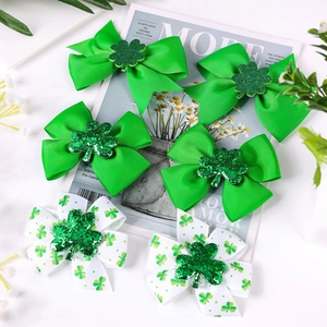 Detailed view of Saint Patrick's Day hair clips with green clover and bowknot design