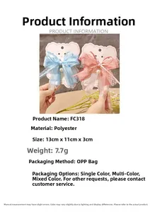 Detailed view of handmade lace bow hair clips with faux pearl accents in blue and pink colors