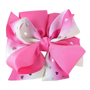 Detailed macro view of pink and white gradient ribbon bow with silver glitter hearts