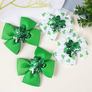 Set of four St. Patrick's Day clover hair bows with green glitter shamrock centers