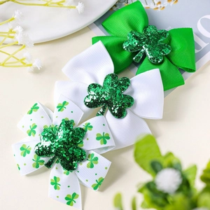 Detailed set of St. Patrick's Day hair clips with green shamrocks and grosgrain bows
